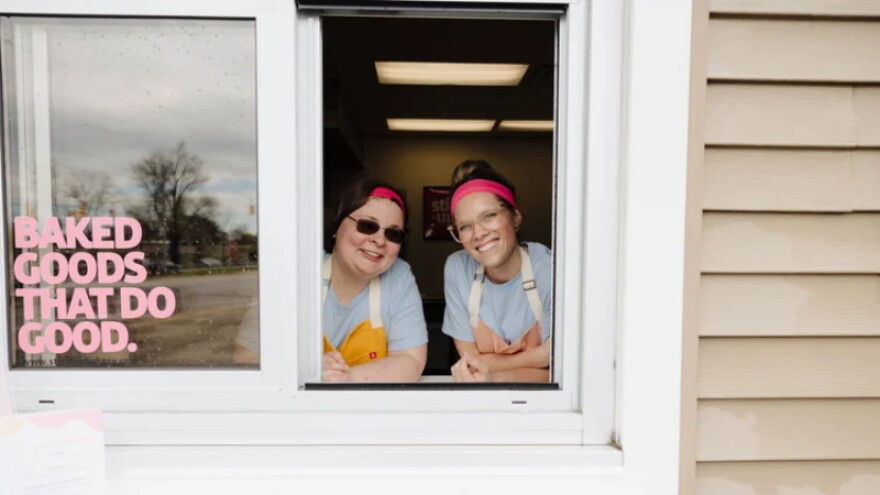 Two employees at Stir It Up's walk-up window.