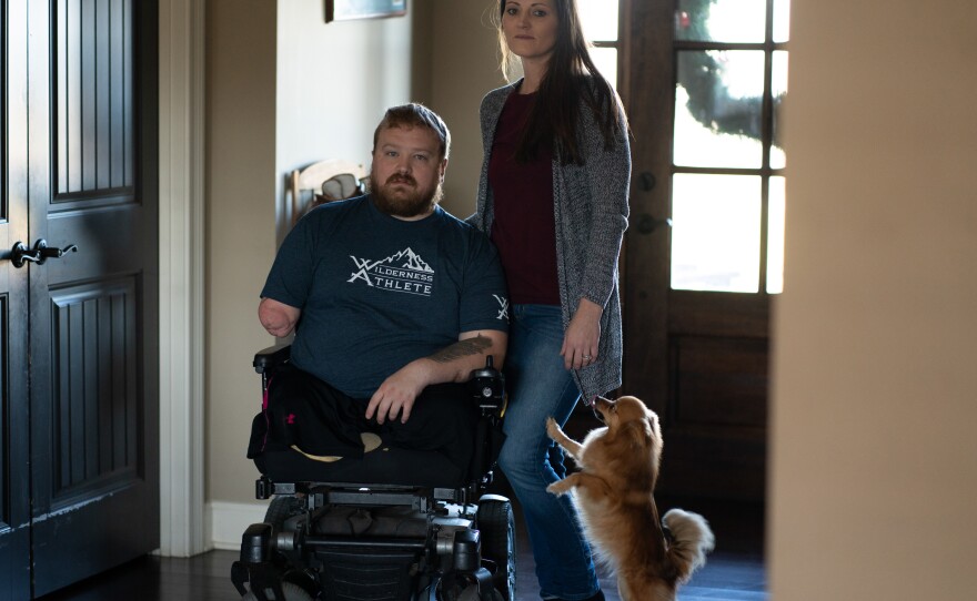 Former Staff Sgt. J.D. Williams poses for a portrait with his wife and caretaker Ashlee Williams.