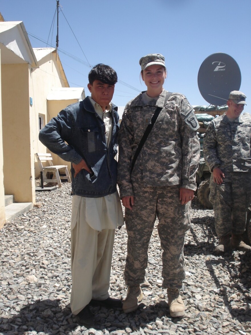 Qasim Rahimi, left, with an ISAF soldier after a press conference in 2008, when Rahimi worked as a journalist for Ariana TV in the Ghazni province of Afghanistan.