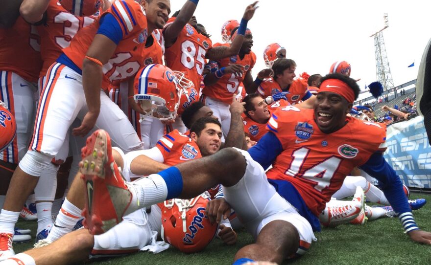 Florida players celebrate in front of the band after their victory.