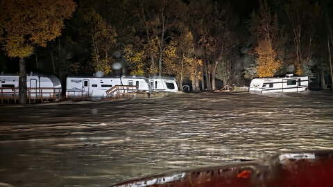 Floodwaters surround trailers at the Fun Valley Family Resort campground and RV part in South Fork, Colo., early Friday, Oct. 23, 2026. (South Fork Fire Rescue via AP)