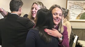 Attorney Kelly Fitzpatrick, right, hugs plaintiff Soryorelis Henry, foreground right, after a news conference in New Haven, CT, Monday, Sept. 9, 2024, where dozens of women who say they suffered excruciating pain at a Yale University fertility clinic because a nurse stole fentanyl for her own use and replaced it with saline, have settled their lawsuits against the Ivy League school.