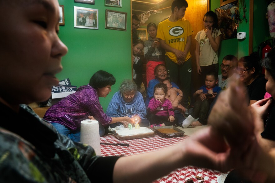 Lizzie Chimiugak Nenguryarr's family gathers to celebrate her 90th birthday at her home in Toksook Bay. She was the first person counted for the 2020 census.