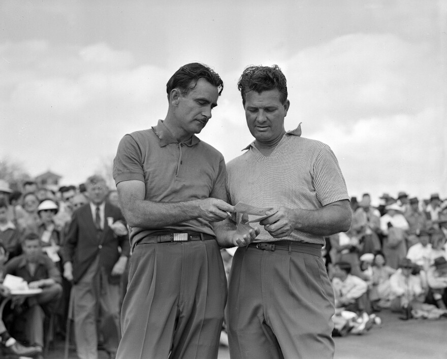 Jimmy Demaret, right, and Lloyd Mangrum check scores after completing the third round of the Masters Golf tournament at Augusta, Ga., April 5, 1947. (AP Photo/Rudolph Faircloth)