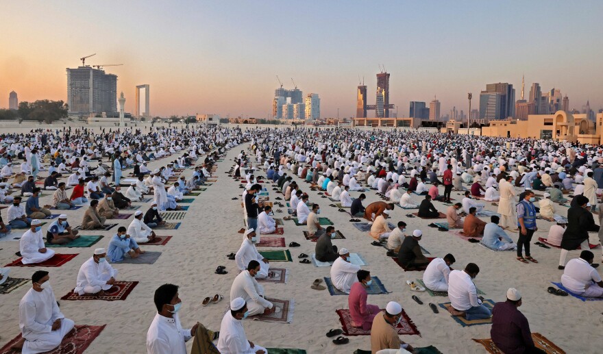 Muslim worshippers perform the Eid al-Fitr morning prayer at Dubai's Eid Musalla in the Gulf emirate's old port area.
