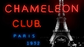 black book cover with neon lighting lettering and Eiffel Tower in background