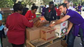 Volunteers preparing grocery bags for more than 500 Parramore residents to eat over the Thanksgiving holiday. Photo: Renata Sago, WMFE.