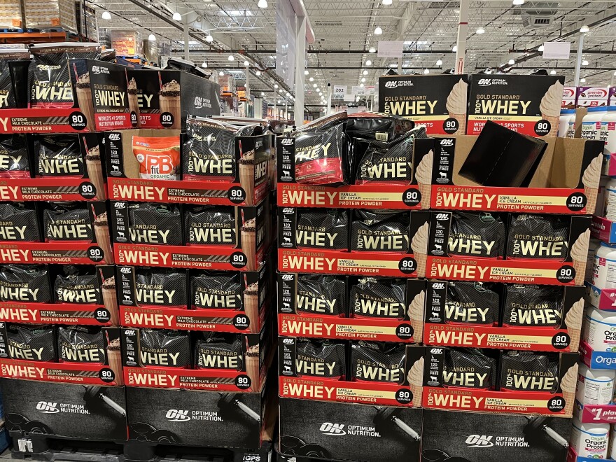 A palette of whey protein powder on sale at a Costco