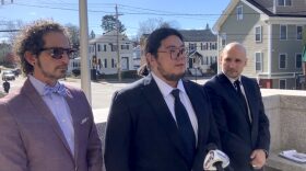 Xiaotian Liu (center) speaks at a press conference with Ron Abramson (left), of Shaheen & Gordon, and Gilles Bissonnette, legal director of the ACLU of New Hampshire. Liu is challenging a Trump administration move to cancel his record of immigration in an online database, on April 22, 2025.
