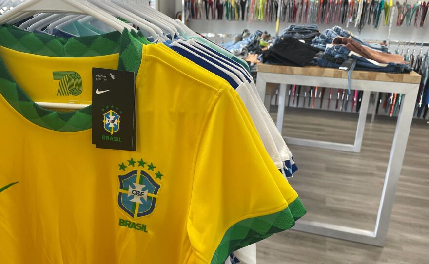 A Brazil soccer jersey hangs inside a store. 