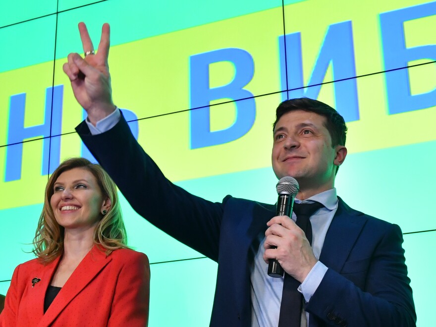 Zelenskiy and his wife, Olena, greet the crowd at his campaign headquarters in Kyiv on March 31. "He's very much a family man," Ukrainian lawmaker Sviatoslav Yurash said.