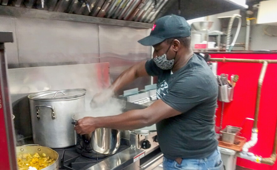 Ronny Brizan is cooking in the kitchen of BB's Hot Spot.