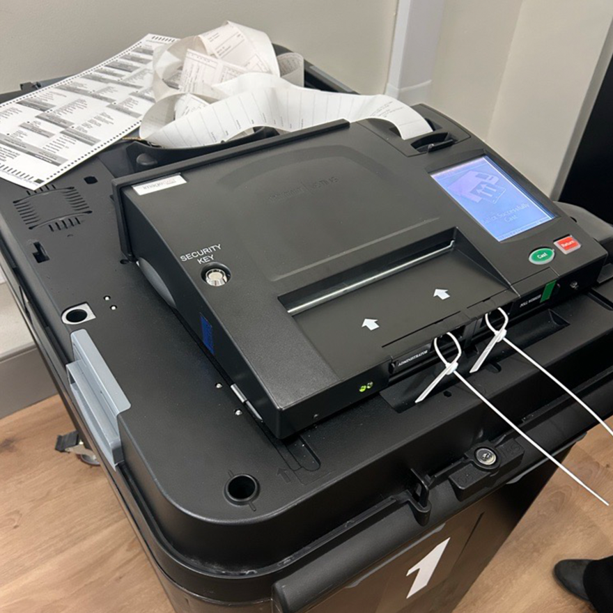 A vote tabulator with zero tape printed out during Saginaw's public accuracy test on Tuesday, Oct. 13, 2026. The tape signifies that no votes have been counted prior to the processing of ballots.
