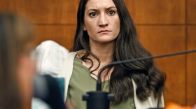 Lindsay Clancy waits for the judge to call a prospective jury member into court in her murder trial where she is charged in the 2023 killing of her three children, Wednesday, July 22, 2026, in Plymouth Superior Court in Plymouth, Mass. (Greg Derr/The Patriot Ledger via AP, Pool)