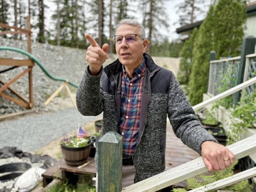 Don Habeger, at his home on View Drive in Juneau, built a large berm around the property to protect it from annual glacial lake outburst floods. (Peter O’Dowd/Here & Now)
