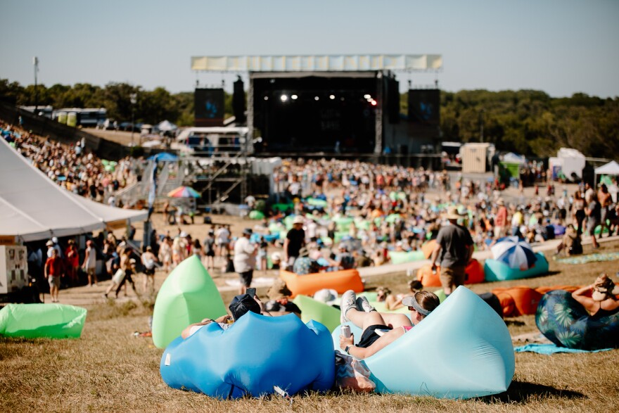 Hinterland festival goers comfortably sit on the top of the hill watching Goth Babe on Saturday, Aug. 6, 2022.