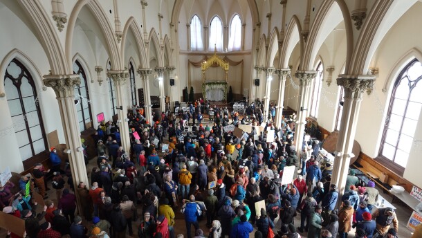 Hundreds gather inside the Agora Events Center in Lewiston to protest ICE