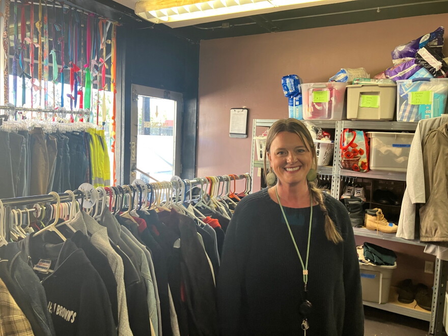 Adamson at The Third Place QC, Friday, Oct. 2, 2026, with donated clothes that they make available for guests.