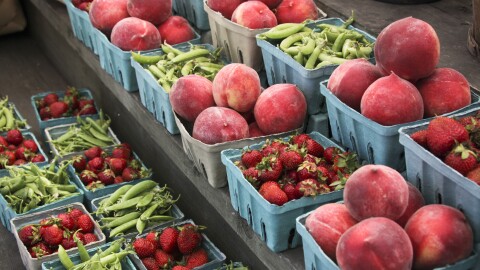 This photo taken June 8, 2013 shows peaches, strawberries, and snap peas are for sale at a roadside market outside Gettysburg, Pa. Pregnant women, mothers and children who get federal assistance with their grocery bills will now be able to buy more whole-grain foods, yogurt, fish, fruits and vegetables.