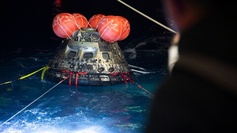 In this photo provided by NASA, NASA's Orion spacecraft is seen as the agency's Landing and Recovery team, along with U.S. Navy personnel work to recover the spacecraft into the well deck of USS John P. Murtha in the Pacific Ocean off the coast of California, Saturday, April 11, 2026. (Joel Kowsky/NASA via AP)