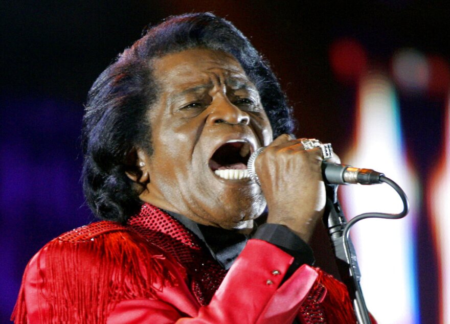 FILE - In this July 6, 2005 file photo, James Brown performs on stage during the Live 8 concert at Murrayfield Stadium in Edinburgh, Scotland. The family of entertainer James Brown has reached a settlement ending a 15-year battle over late singer’s estate. David Black, an attorney representing Brown’s estate, confirmed to The Associated Press on Friday, July 23, 2021 that the agreement was reached July 9. (AP Photo/Matt Dunham, File)
