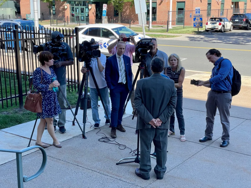 Mike Telesca of the Independent Party talks to reporters outside the courthouse. He accused Stefanowski of "sour grapes."