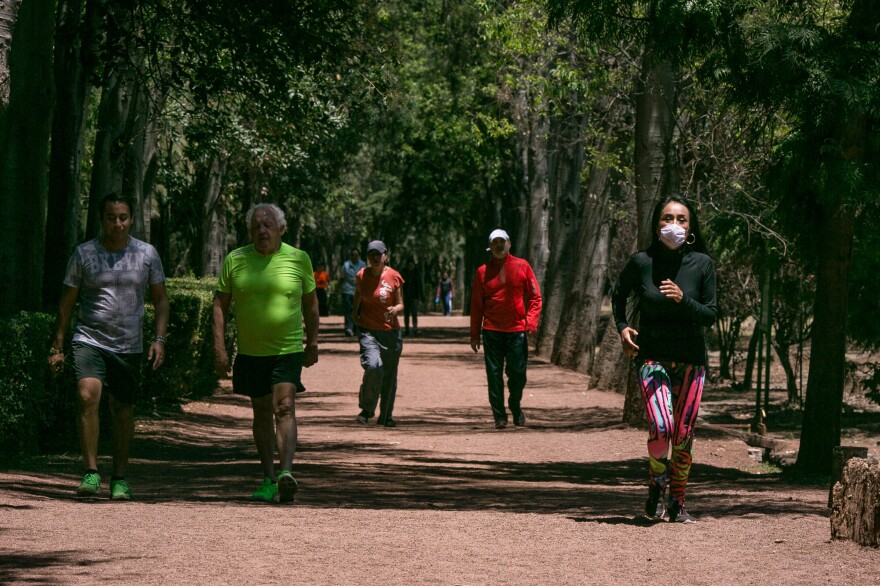 Runners in the wooded park of Viveros in Coyoacan, Mexico City. Mexico City has few runner-friendly spaces. The altitude discourages exertion and the air quality is often so bad some runners wear face masks. Yet health officials urge people to exercise more.