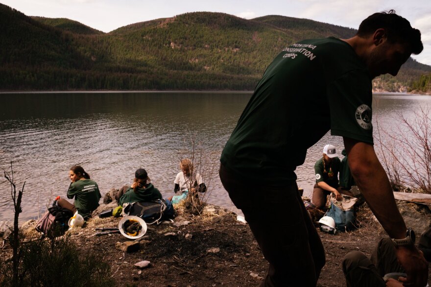 The MCC crew breaks for lunch while spending the day working on the trails near Tally Lake.