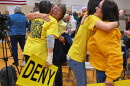 Members of the Archbald community hug each other after borough council denied a data center campus developer's zoning application.