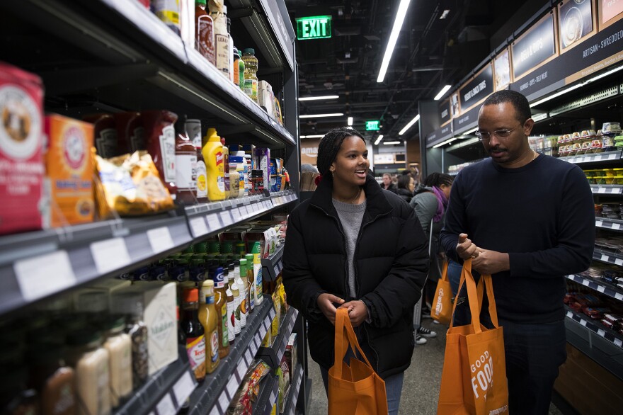Mary Haddish, 14, left, shops with her father, Daniel Ghebre at Amazon Go on Monday, January 22, 2018, on 7th Ave., in Seattle.