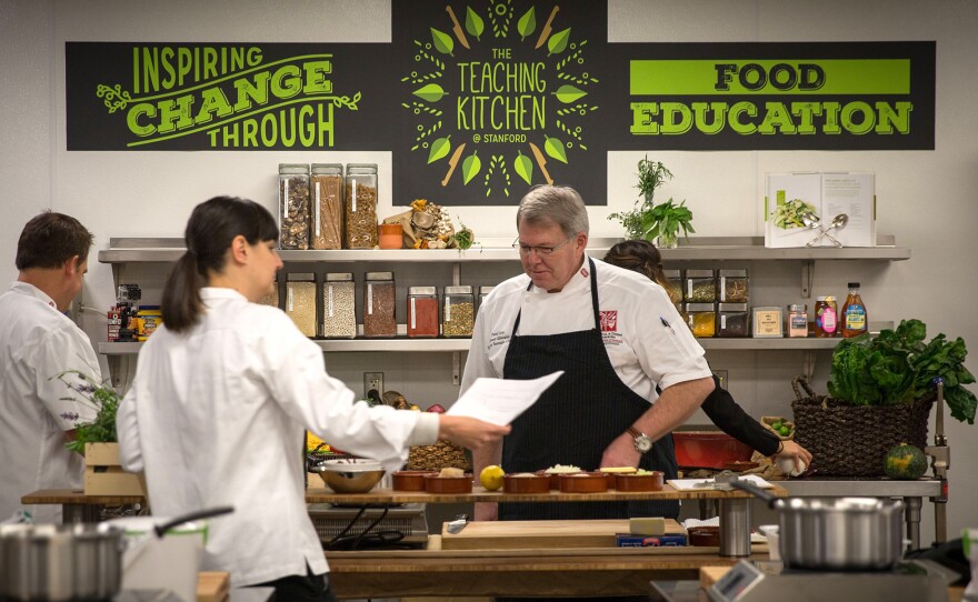 Stanford Teaching Kitchen's culinary team checks on ingredients for the program's various cooking classes.