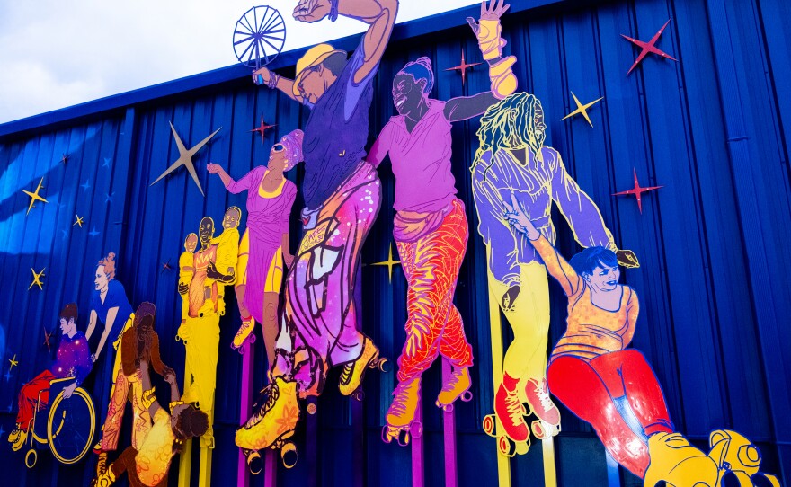 Visual artist Dare Coulter built a mural, inspired by local skaters, along the exterior of Wheels Durham roller skating rink in Durham, North Carolina.