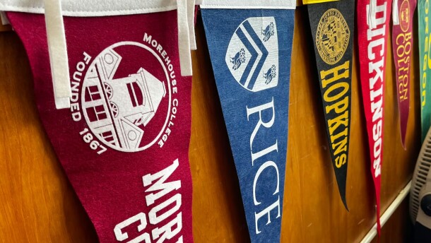 FILE - The Oregon Promise Grant's impact on high school graduate enrollment rates has been muted. Pennants from colleges and universities across the country adorn the office of a Benson High School counselor's office on February 2, 2024.