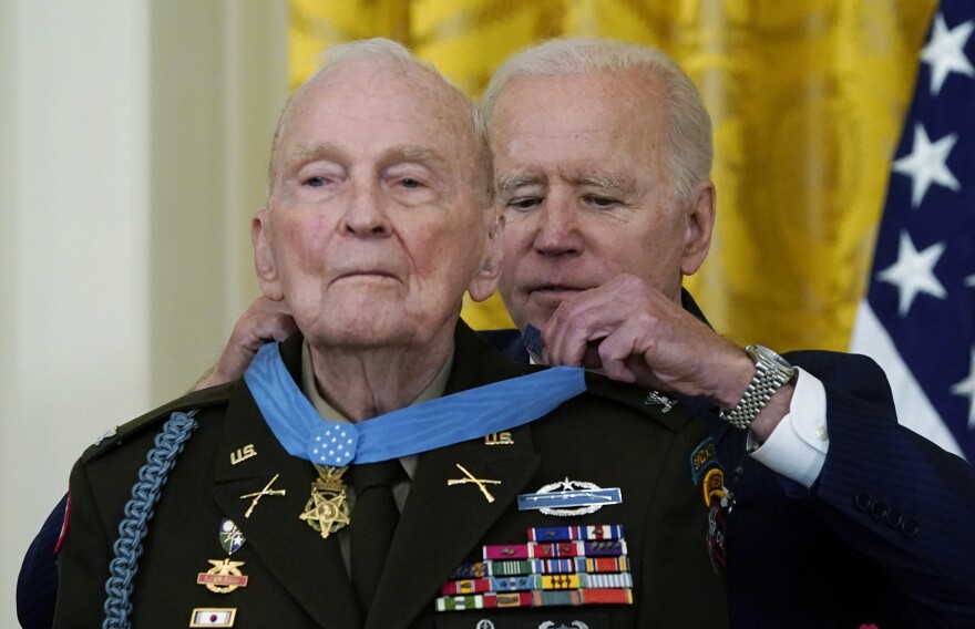 President Biden presents the Medal of Honor to retired U.S. Army Col. Ralph Puckett in the East Room of the White House on Friday.