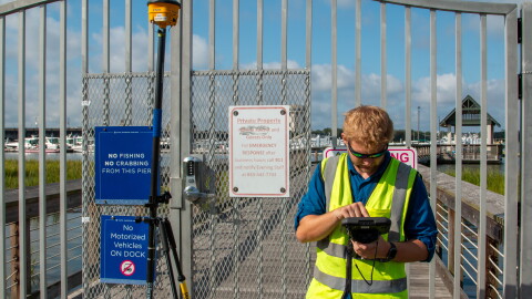 Derek Thorn, a geographer with the U.S. Army Corps of Engineers, Charleston District, conducts topographic surveys near Brittlebank Park and the Ashley River bridges on the westside of downtown Charleston, South Carolina, Sept. 11, 2026, to determine precision elevation markers for the planned perimeter storm surge barrier. The Charleston Peninsula Coastal Storm Risk Management project kicked off in 2018 to reduce storm surge risks, protect vital transportation corridors, and bolster long-term coastal resilience across the low-lying peninsula with an engineered 10-foot NAVD88 barrier alignment. (U.S. Army Corps of Engineers photo by Dylan Burnell)