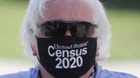 Amid concerns of the spread of COVID-19, census worker Ken Leonard wears a mask as he mans a U.S. Census walk-up counting site set up for Hunt County in Greenville, Texas, Friday, July 31, 2020. (AP Photo/LM Otero)