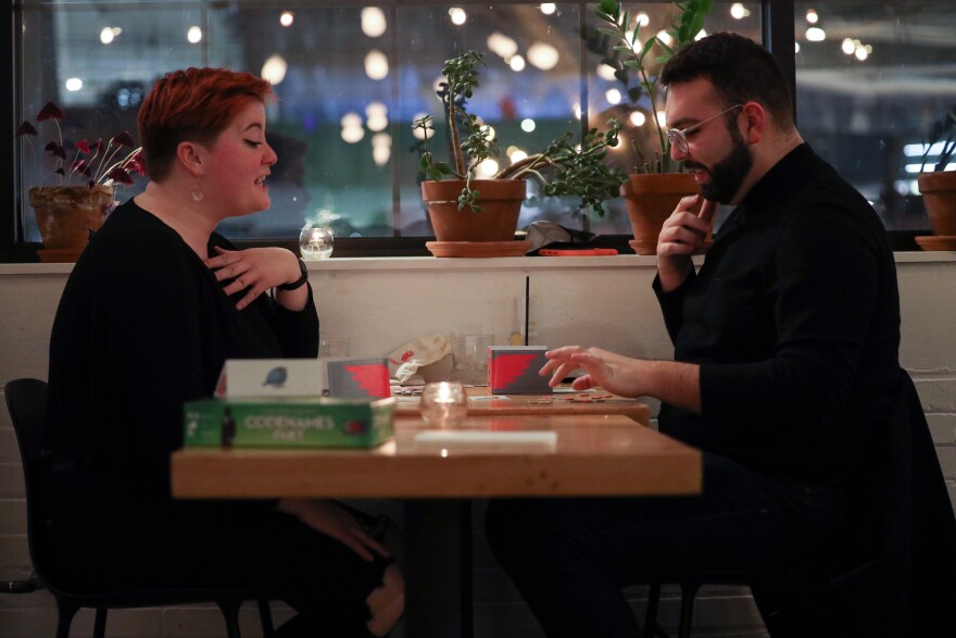 Marley Derosia and Gianluca D'Elia play A Little Wordy at Game Night Rochester at Radio Social.