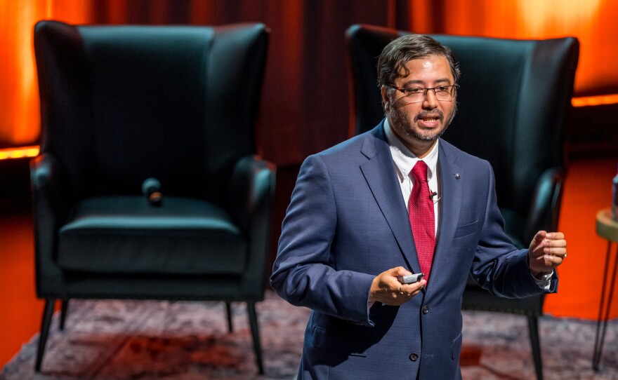 Ashique KhudaBukhsh, assistant professor in the Department of Software Engineering and affiliate of the ESL Global Cybersecurity Institute, speaks during an inauguration event, RIT in Coversation, on Friday, Sept. 26, 2025, at Sklarsky Glass Box Theater in the SHED Student Hall for Exploration and Development.
