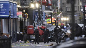 EDS NOTE: GRAPHIC CONTENT - Emergency personnel work the scene on Bourbon Street after a vehicle drove into a crowd on New Orleans' Canal and Bourbon Street, Wednesday Jan. 1, 2025. (AP Photo/Gerald Herbert)