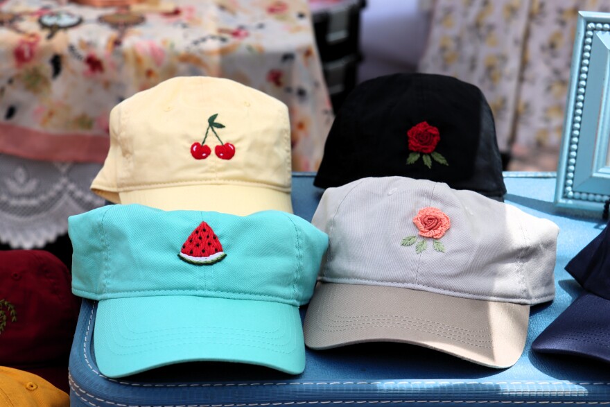 Erin Boyle's hand-embroidered hats are her money makers.