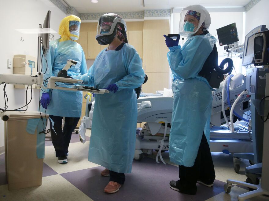 COVID-19 mortality rates are going down, according to studies of two large hospital systems, partly thanks to improvements in treatment. Here, clinicians care for a patient in July at an El Centro, Calif., hospital.