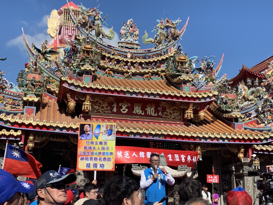 A supporter gets the crowd amped up for opposition presidential candidate Han Kuo-yu at a campaign rally at a Hakka temple in Taiwan's Miaoli county<strong></strong> in November. The tense China relationship and Hong Kong protests are big issues for Taiwan as it prepares to vote in January.