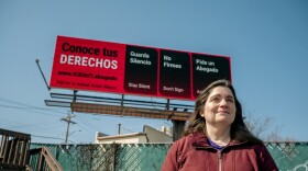 Laura Cassenti, a member of MA/CT Stop Avelo, which protested against Avelo Airlines' participation in deportation flights, stands in front of a billboard advising people of their legal rights during immigration raids, in New Haven on March 11, 2026. The sign originally meant to advertise a boycott against Avelo, is now running until March 22nd.