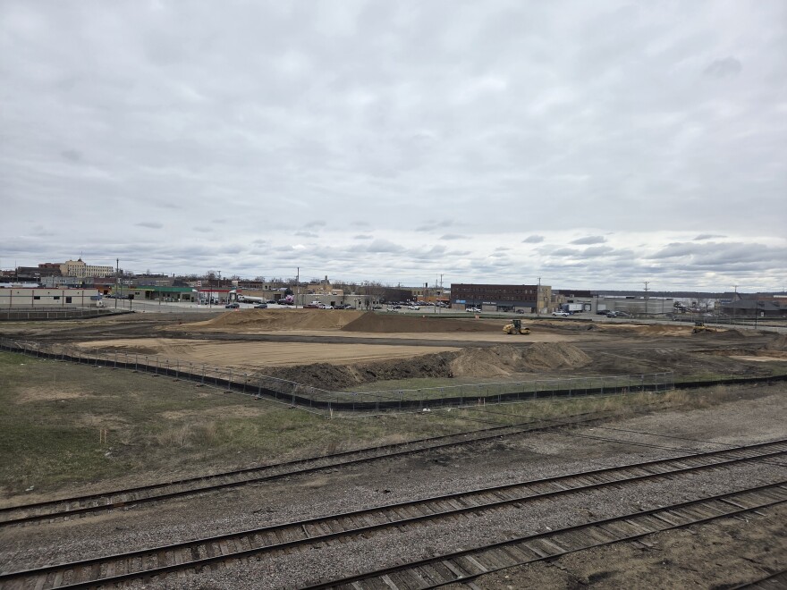 Earthwork continues at the future site of a YMCA wellness center as the Bemidji rail corridor, seen here from the Irvine Avenue bridge, transforms on April 29, 2026.