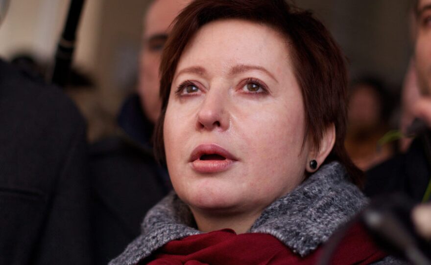 Kozlov's wife, Olga Romanova (shown here during his trial March 15), is a Russian journalist and opposition activist.