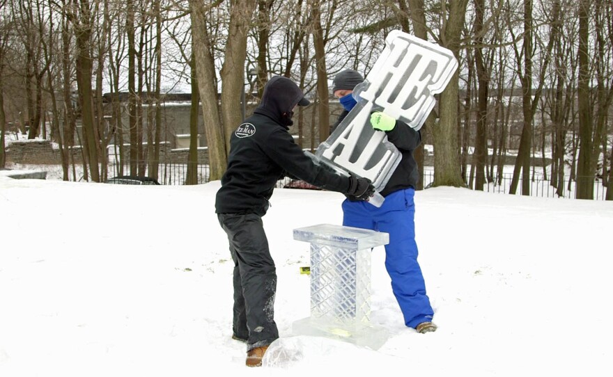 Installing an ice sculpture at the Hyde Collection