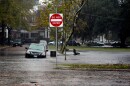 Cars in Norfolk after heavy rains brought six inches of rain in some parts of the city in 2009. One car is partially submerged in water. 