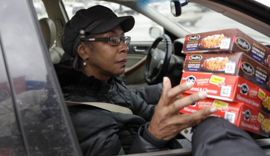 Stouffer's handed out free meals to federal workers in Solon, Oh., Wednesday, Jan. 16. Gayle Bell works at the Department of Treasury and has gone without pay for weeks. 