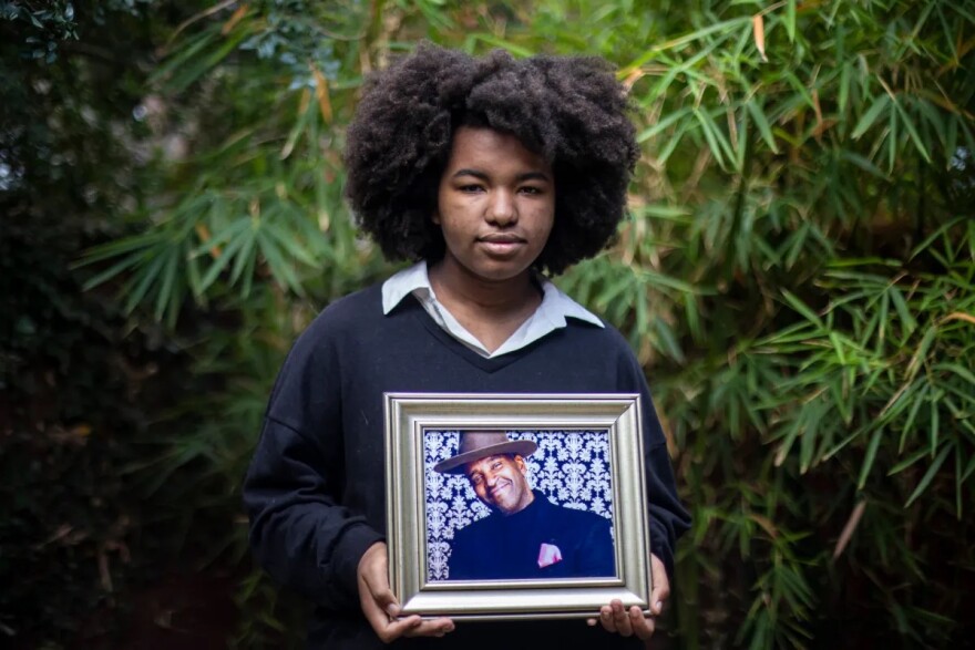 MacLemore Porter, whose father died of COVID, poses for a photo in her backyard in Bakersfield on June 22, 2022.