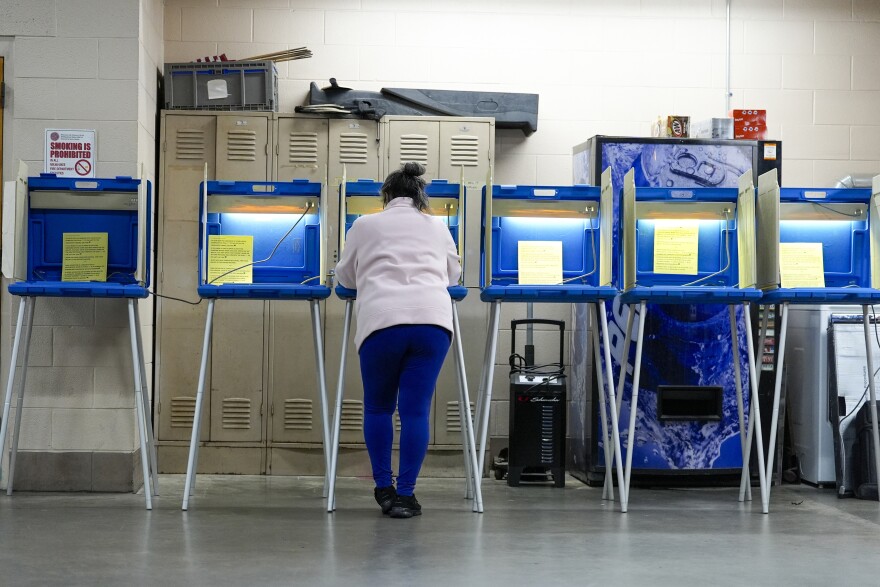 A voter casts her ballot during the Spring election Tuesday, April 2, 2024, in Milwaukee, Wis.